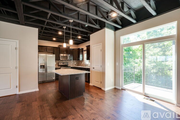 A kitchen with a large island in the middle of the room.
