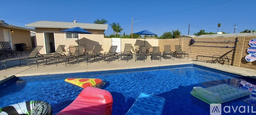A pool with a red float and a blue float in it.