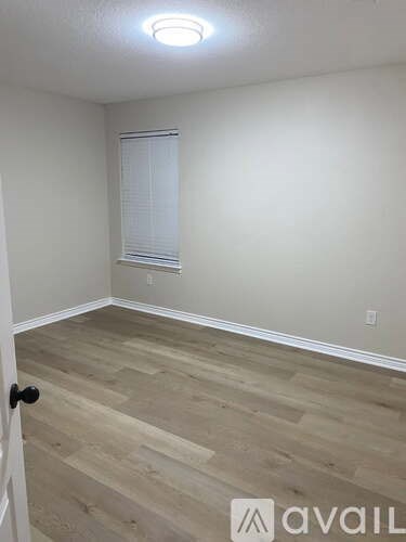 A bathroom with a sink, mirror and toilet.