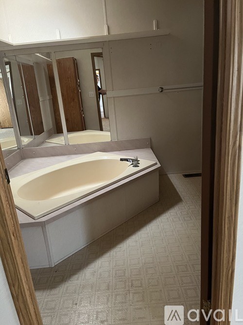 A bathroom with a bathtub and a toilet.