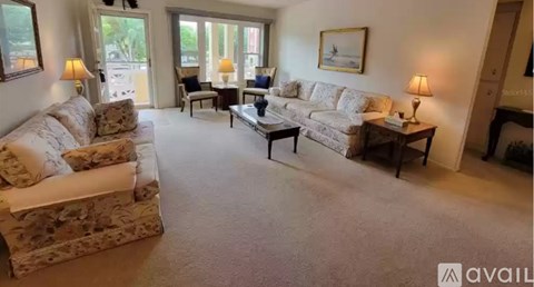 A living room with a couch, chair, and coffee table.