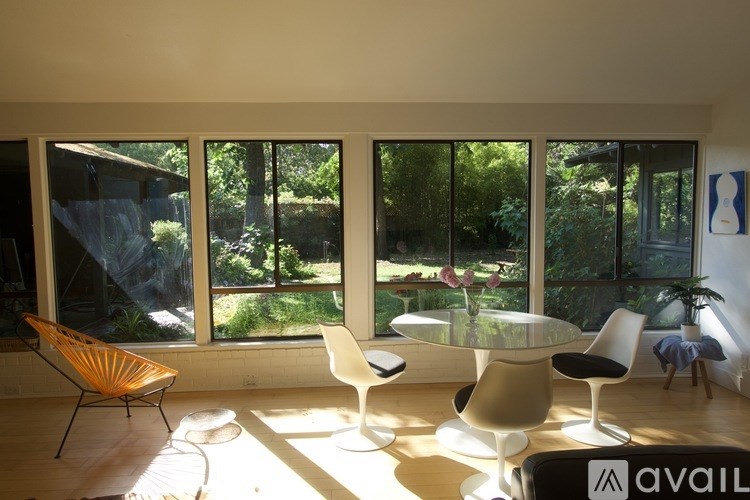 A room with a table and chairs in it.