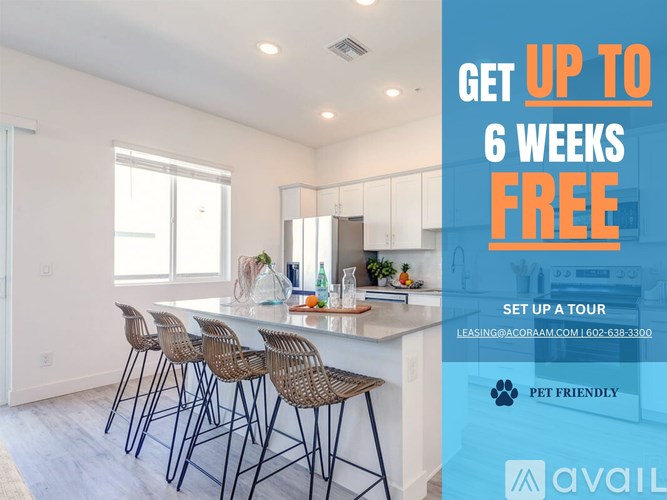 A kitchen with a bar area and chairs, advertising a free first month for a move in special.