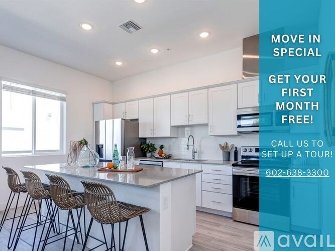 A kitchen with a counter and chairs and a sign offering a free month to move in.