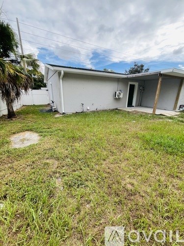 A house with a yard in front of it.