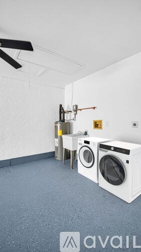 A laundry room with a washer and dryer.