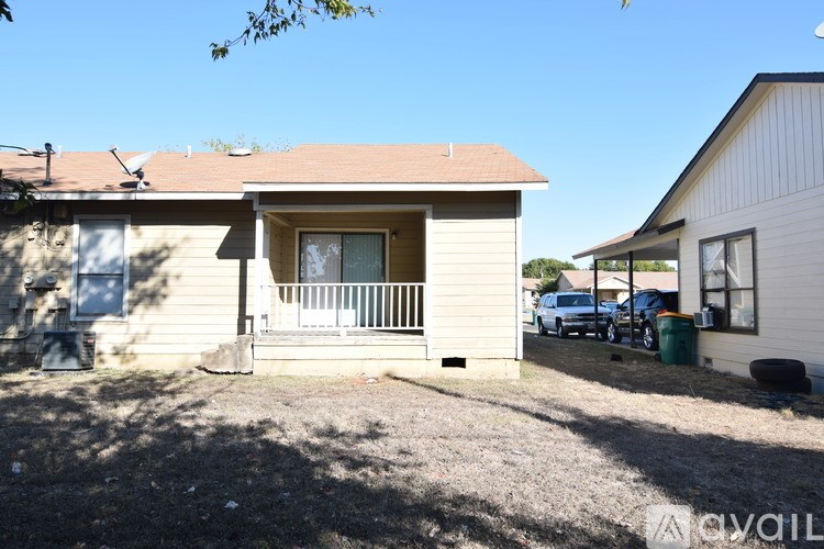 A house with a brown roof and a white door is shown.