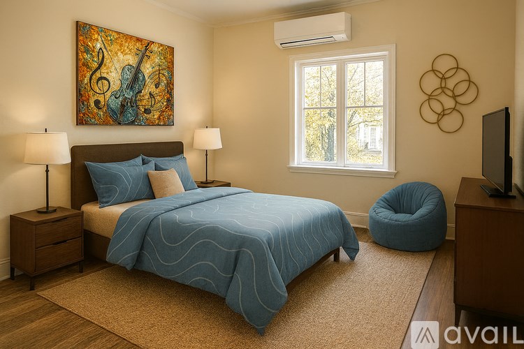 A bedroom with a large bed and a painting on the wall.