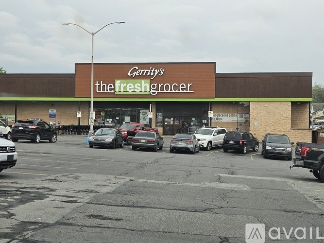 A parking lot in front of a grocery store.
