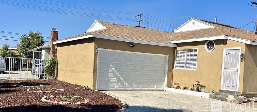 A house with a garage and a driveway.