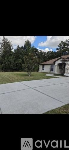 A house with a driveway in front of it.