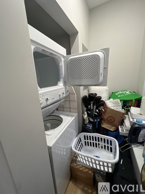 A small kitchen with a dishwasher and a microwave.