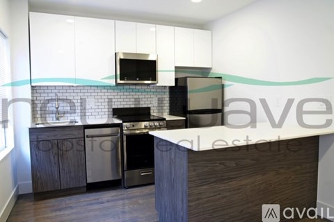 A kitchen with a stove top oven and a microwave above it.