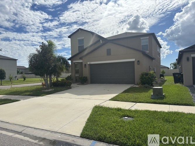 A house with a garage is available for sale.