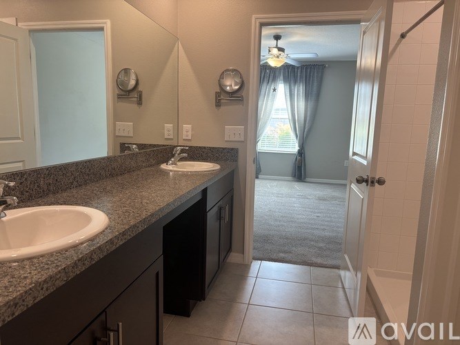 A bathroom with a sink and mirror.