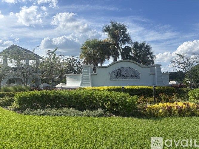 A sign that says "Bellafont" is in front of a white house.