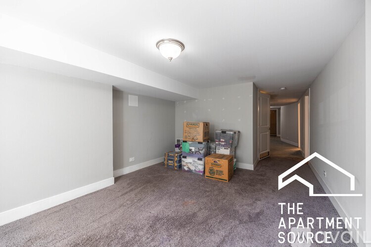 Apartment source online logo on a carpeted room.