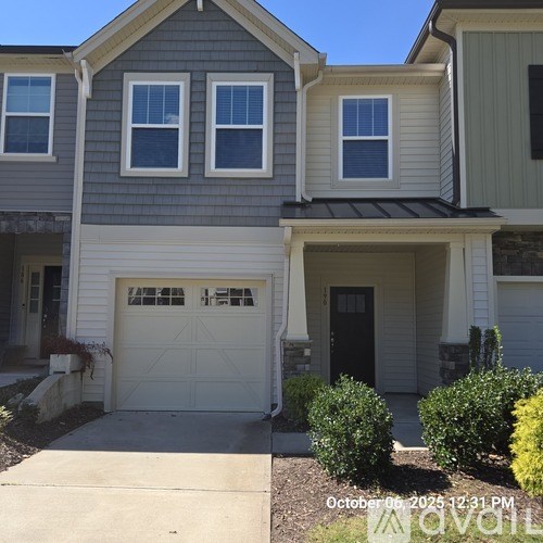 A house with a garage door that has a window on it.