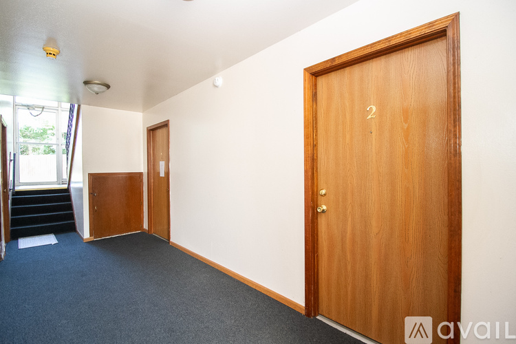 A room with a door numbered 2 and a staircase.