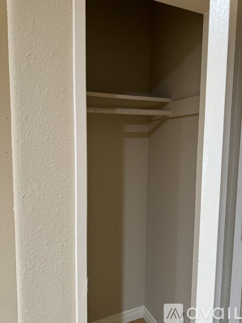 A white doorway leads to a hallway.