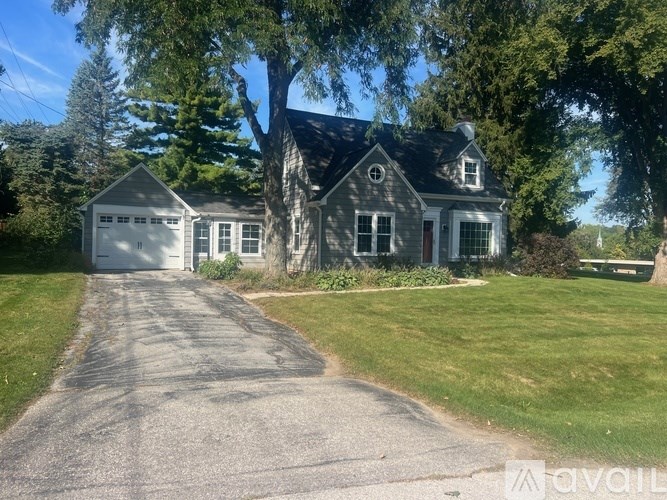 A house with a driveway in front of it.