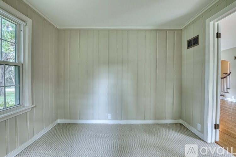A modern stainless steel oven with a digital control panel is installed in a kitchen.