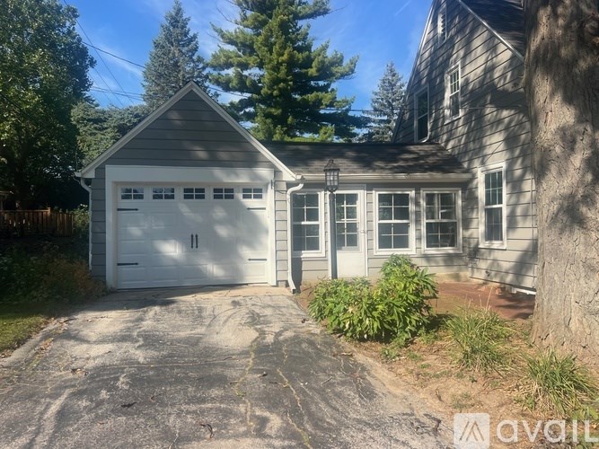 A two-car garage is attached to a house.