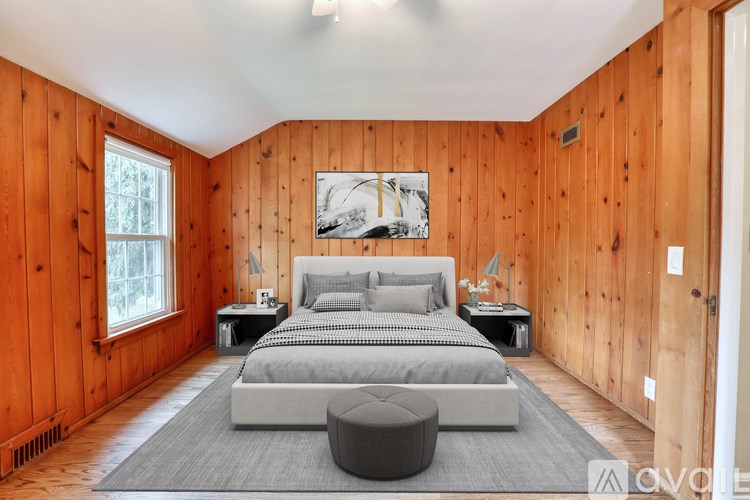A bathroom with a toilet, sink, and mirror.