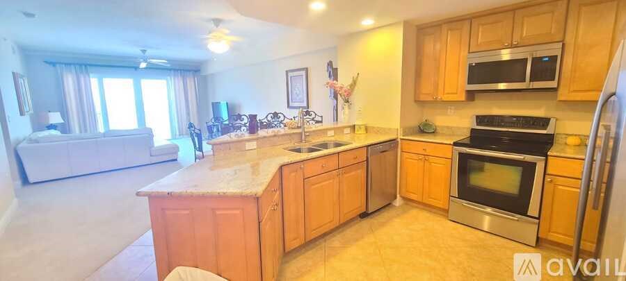 A kitchen with wooden cabinets and stainless steel appliances.