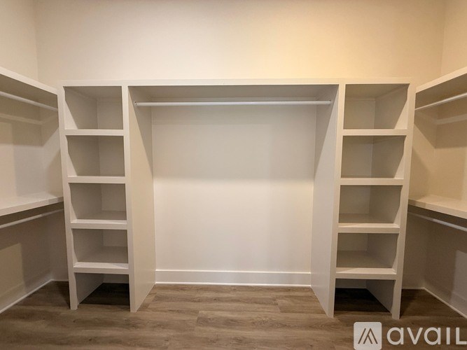 Empty white shelves in a room.