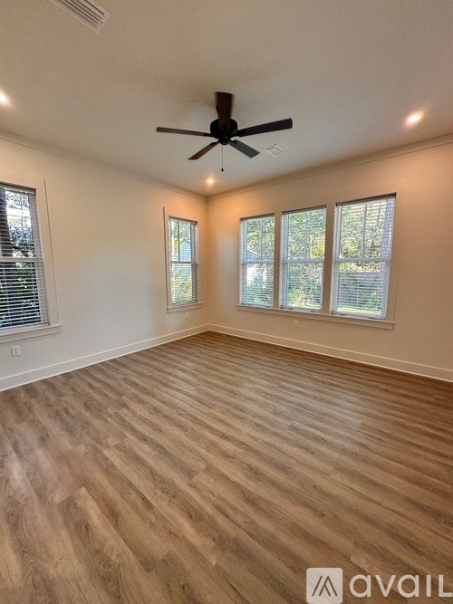 A bathroom with a walk-in shower and a vanity.