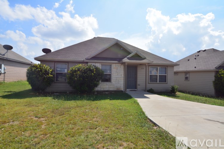 A house with a lawn in front of it.