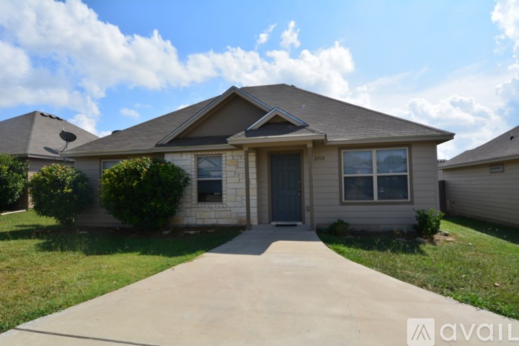 A house with a driveway in front of it.