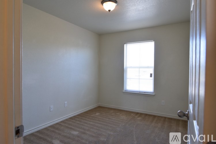 A room with a window and a door.