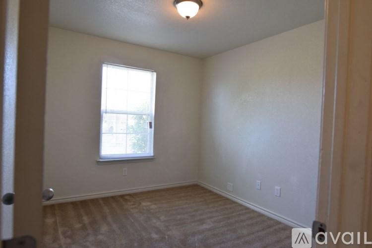 A room with a window and a door.