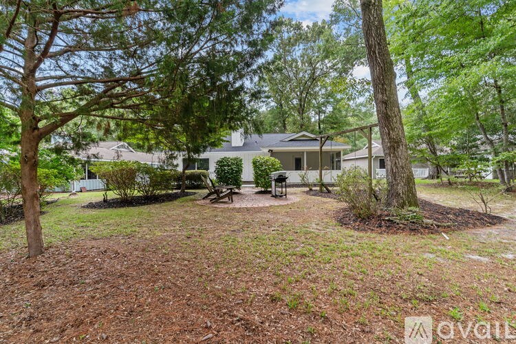 A house with a tree in front of it.