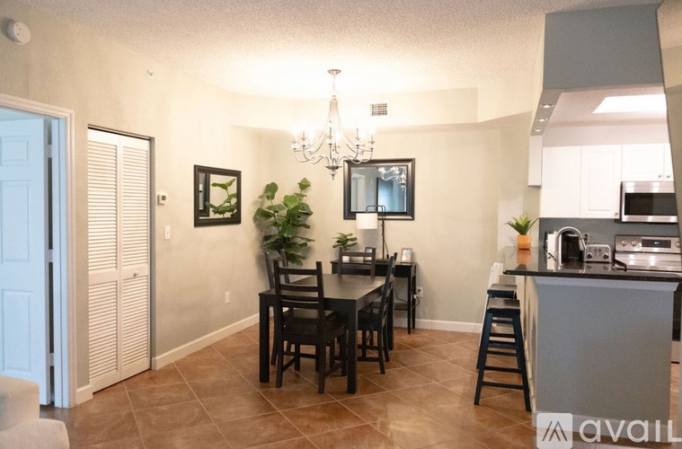 A dining room with a table set for six.
