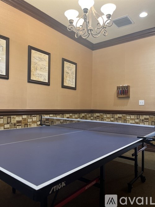 A bedroom with a bed, chair, and window.
