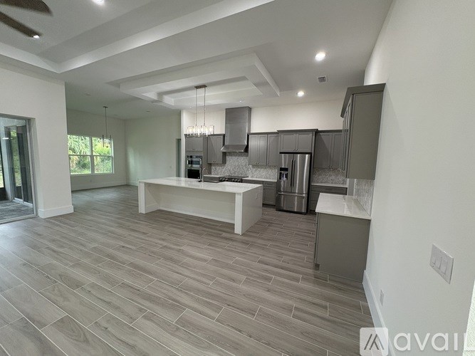 A modern kitchen with a large island in the middle.