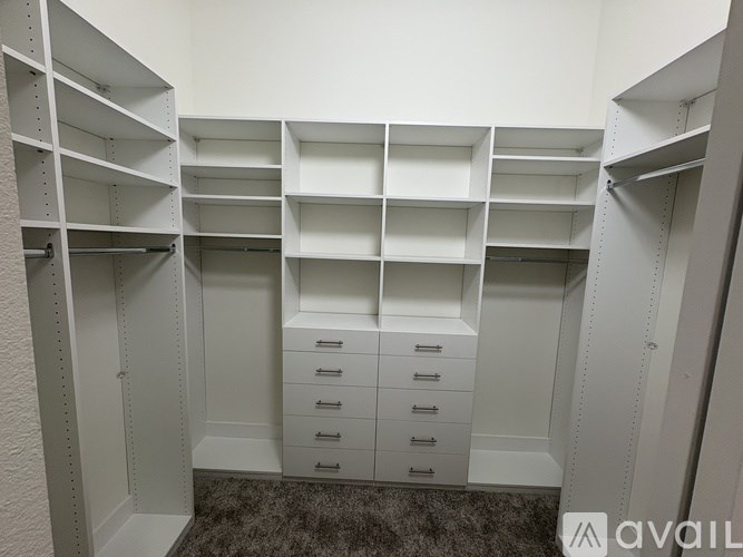 A white storage unit with shelves and drawers.