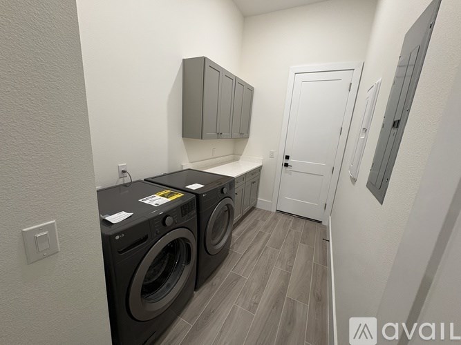 A laundry room with a washer and dryer.
