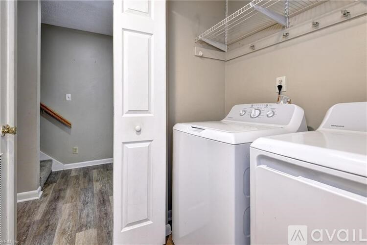 A laundry room with a washer and dryer.