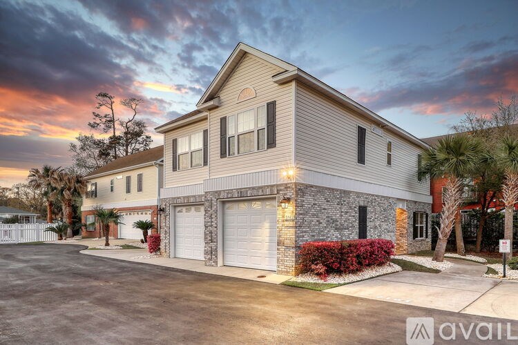 A house with a garage is available for sale.