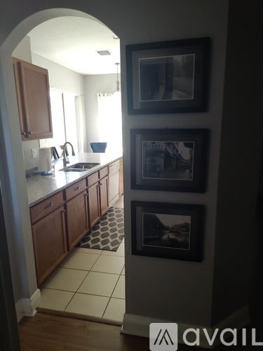 A kitchen with wooden cabinets and a sink.