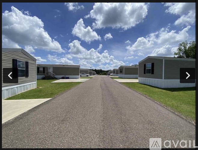 A row of houses with a road in between.