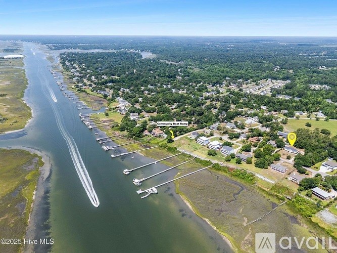 A bird's eye view of a coastal area with a river running through it.