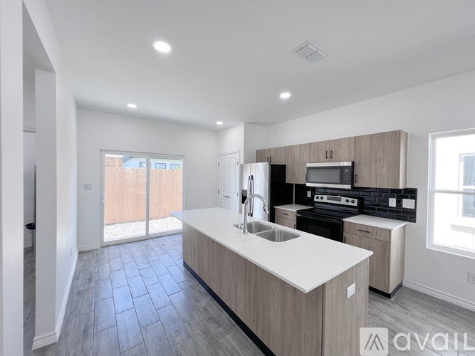 A modern kitchen with a large island in the middle.
