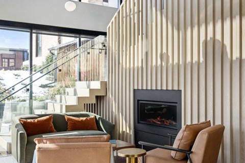 A living room with a fireplace and a couch.