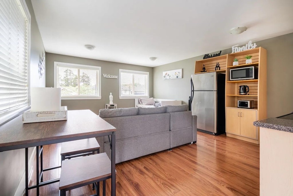 A kitchen with a refrigerator and a countertop.