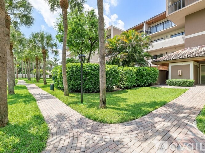 A walkway with a lamp post and a building in the background.